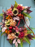 Harvest Sunflower wreath with sunflowers, apples and a burgundy ribbon